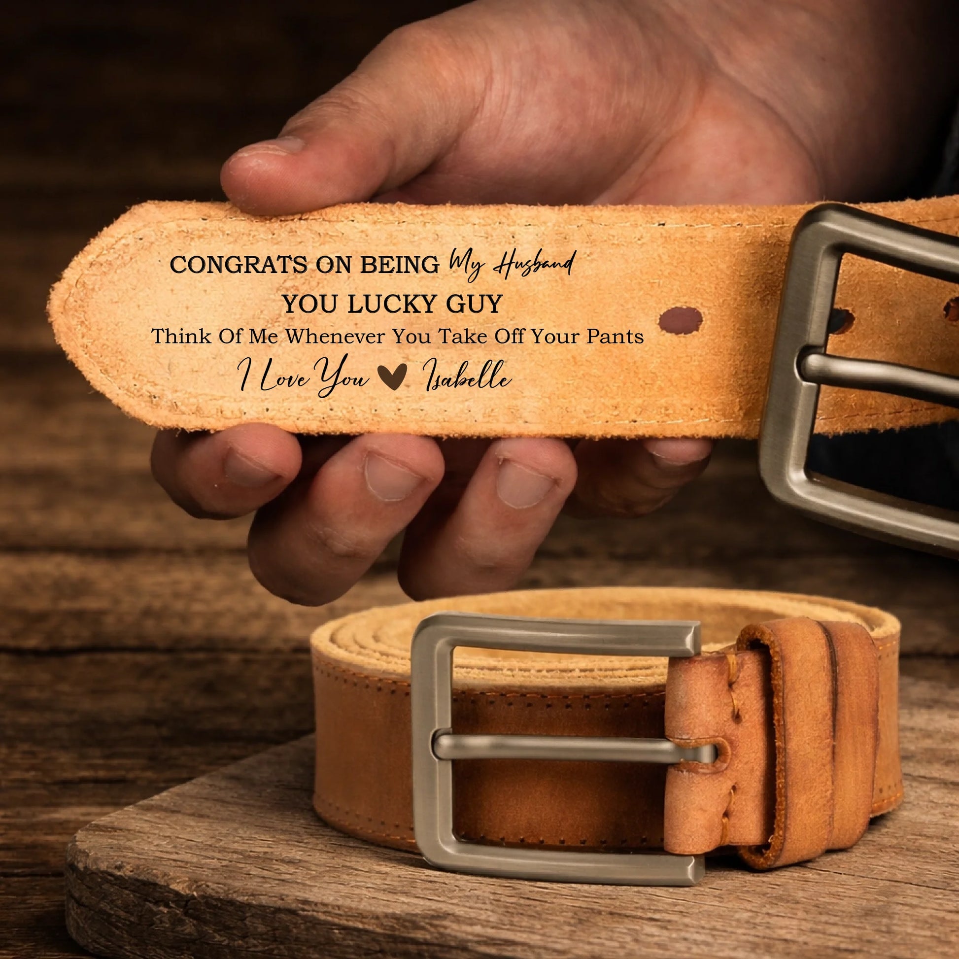Leather belt on rustic wood surface